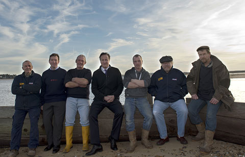 Prime Minister David Cameron with some of the crew at lifeboat station after the flood 