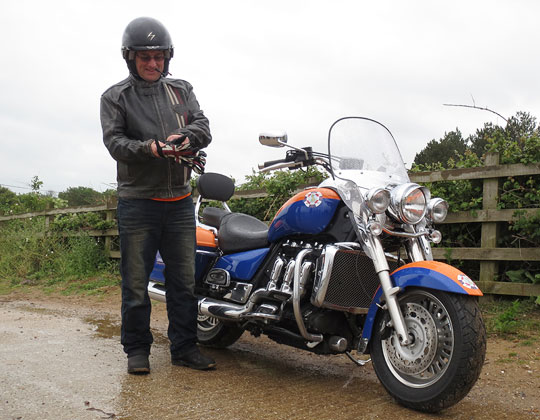 Getting ready, with his custom painted Triumph Rocket III touring