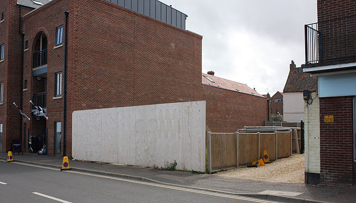 The site on the quayside for the new mural, fronting land left empty after the 2005 fire