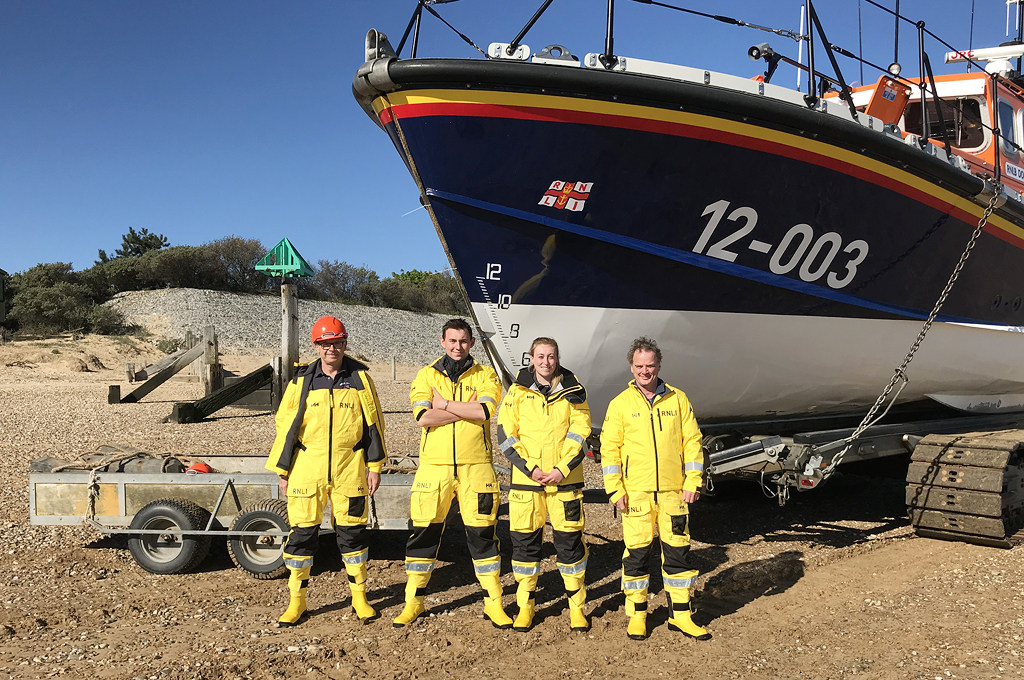 Crew members preparing for a low water launch on exercise with the new Helly Hansen clothing