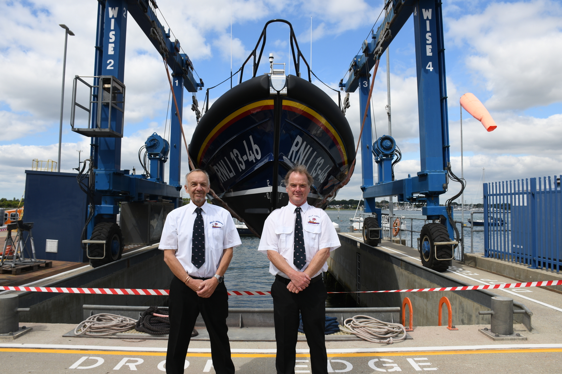 Wells crew members Ray West and Max Phillips with the new lifeboat