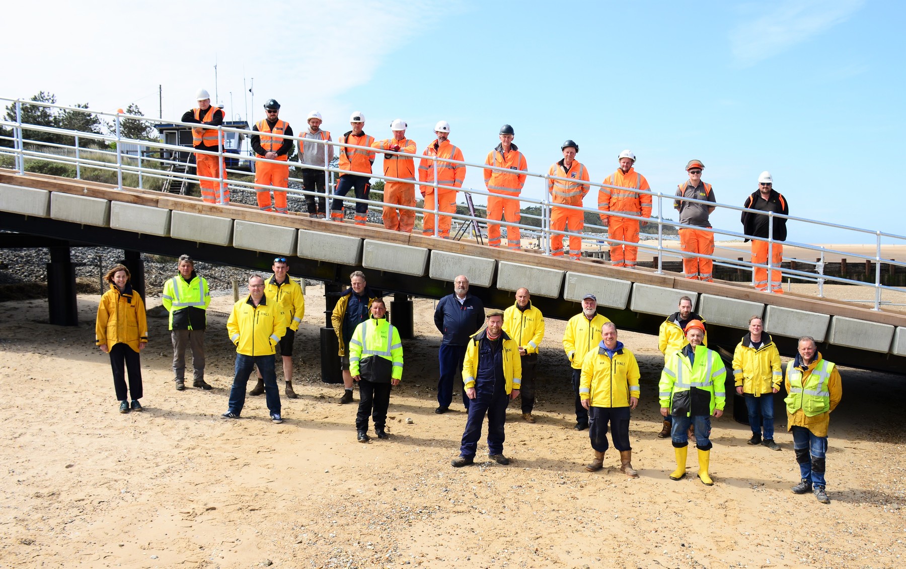 Lifeboat crew with the Mackley construction crew on the new all-weather lifeboat ramp