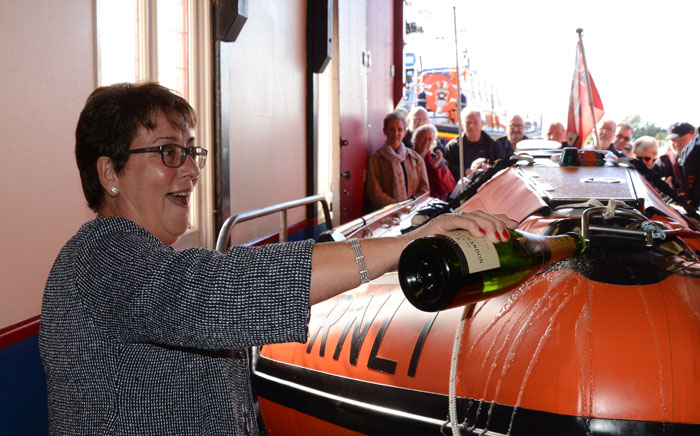 Jayne Wilcox names the station's new inshore lifeboat D-797 'Peter Wilcox'