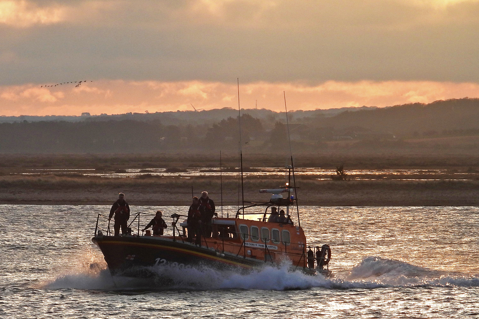A last nod to the town and a run past the site of her old boathouse at start of the journey