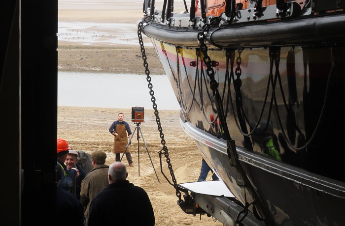 Getting the crew organised in front of the boathouse