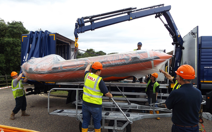 Unloading the new inshore lifeboat on the beach road