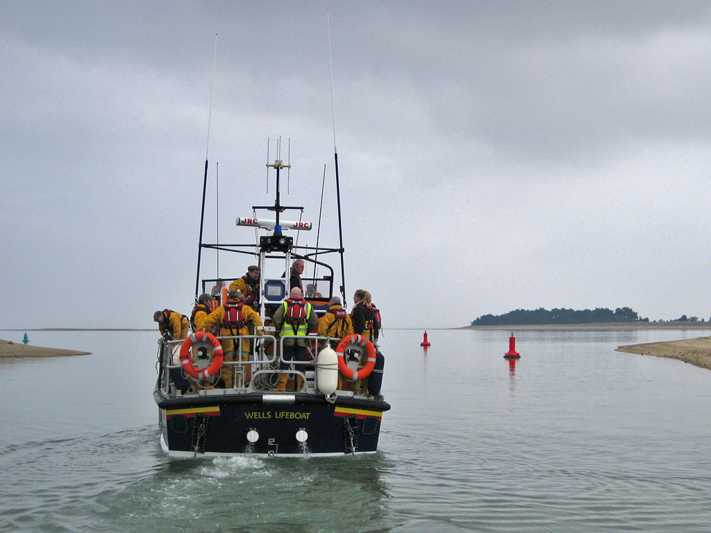 Allen at the helm with a boat-full of crew on his last exercise before retirement
