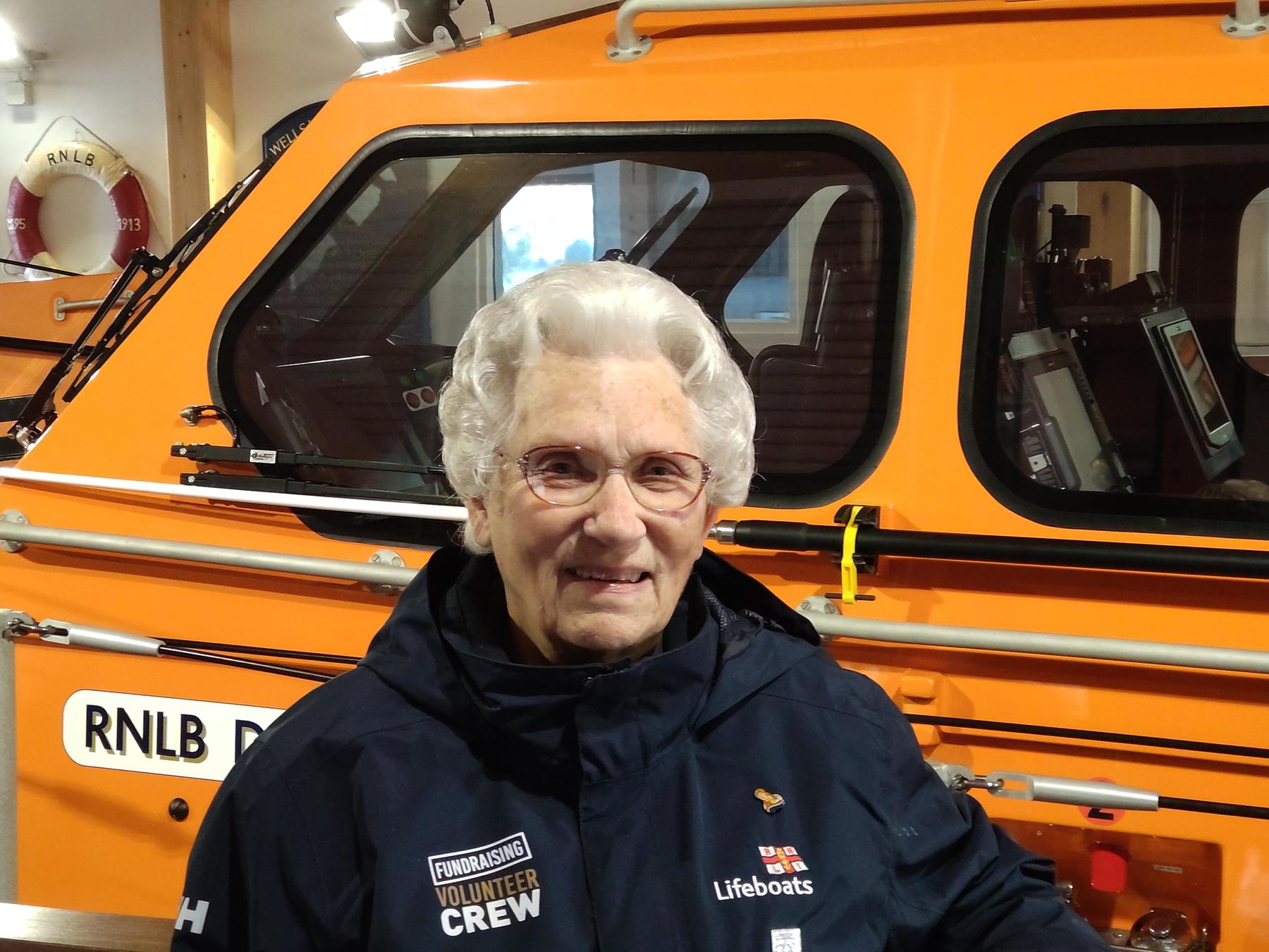 Sheila Warner awared MBE for 65 years service, pictured with the present Wells lifeboat