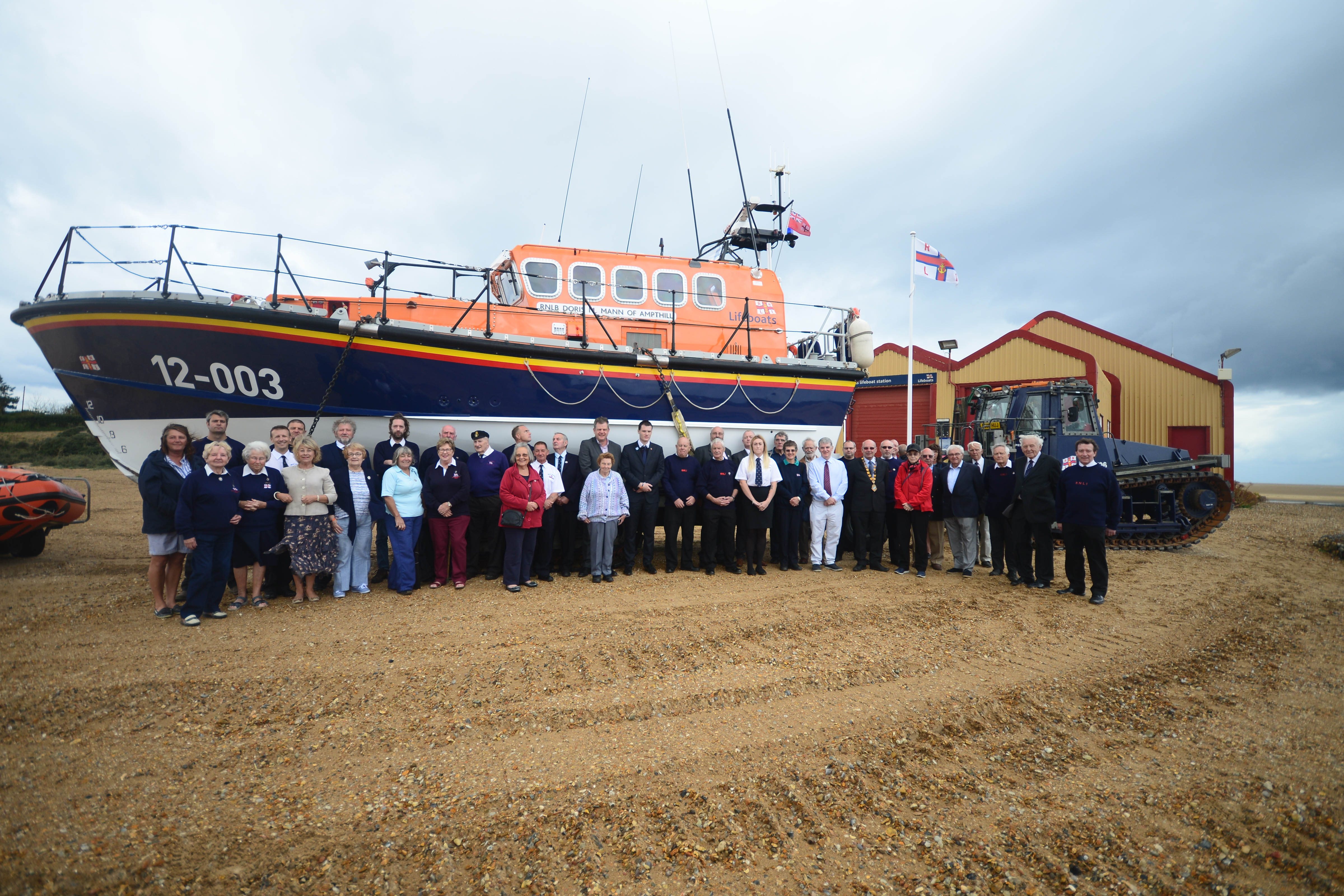 Crew members and guests with our current all-weather lifeboat Doris M Mann of Ampthill