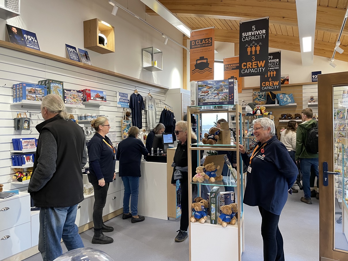 Volunteers welcome customers to the new shop and visitor information centre
