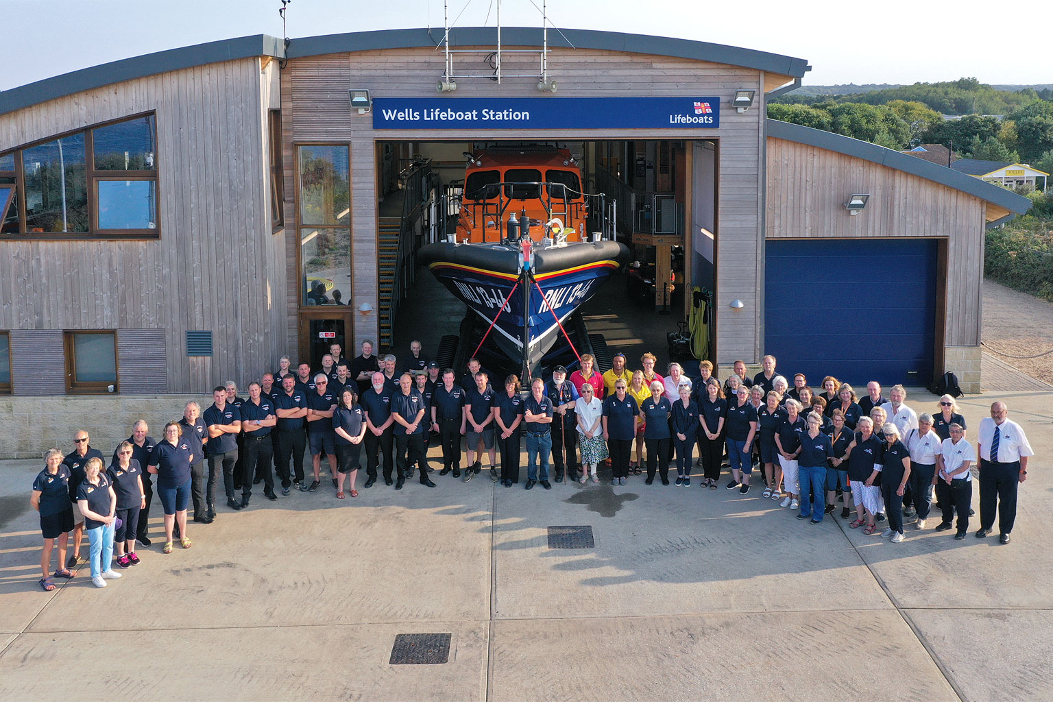 RNLI Wells volunteers - crew, launchers, management, guild, shop and visits team - all together at 18:24 on 1/8/24