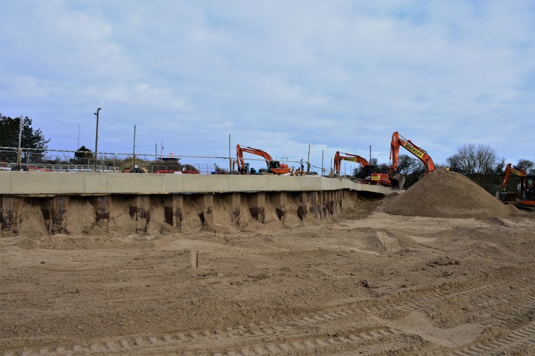 Sheet piled perimeter and capping beam prior to timer terraces being installed