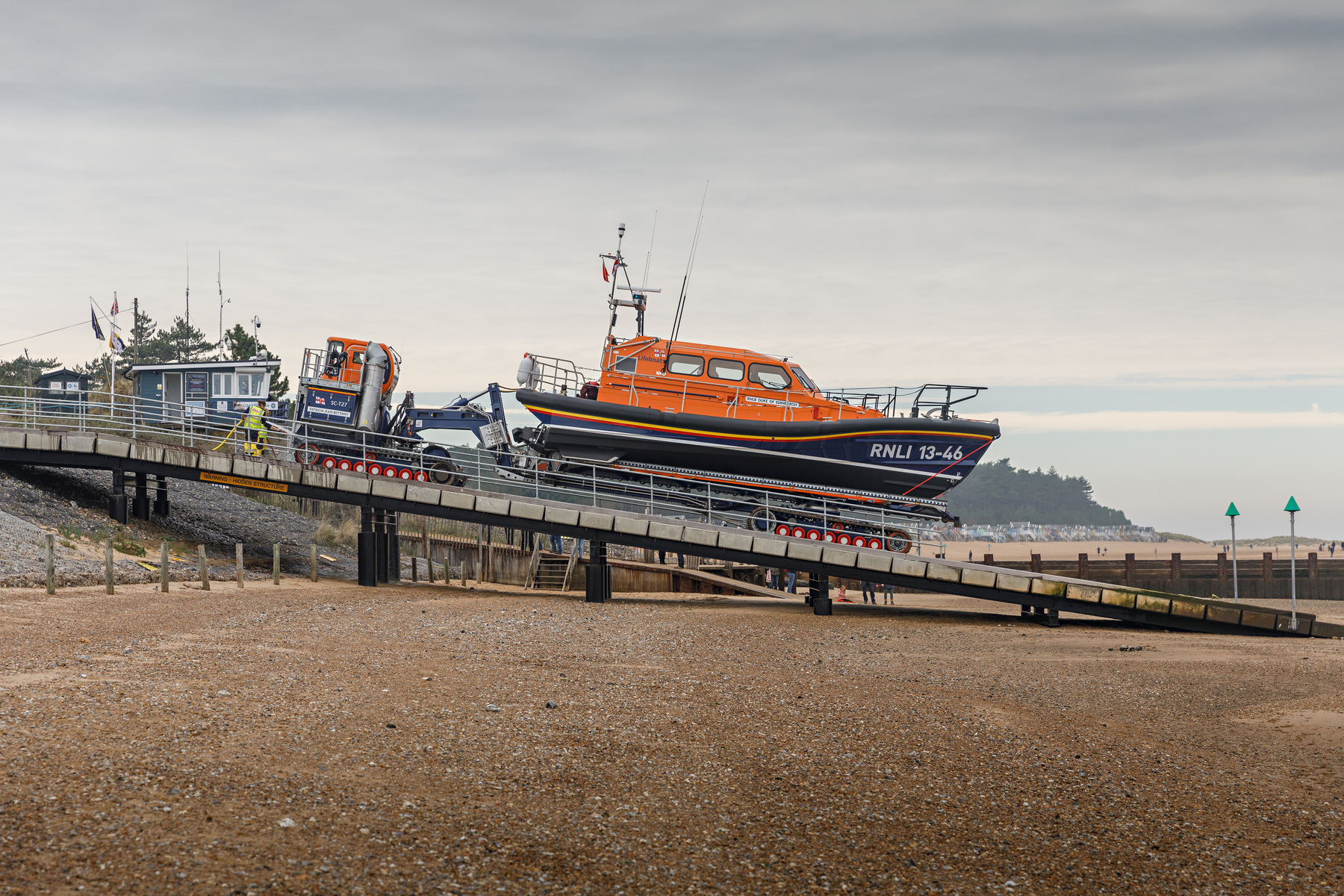 Washing down the tracks on the SLRS before 13-46 is put away in the new Wells Lifeboat Station, 13/11/22