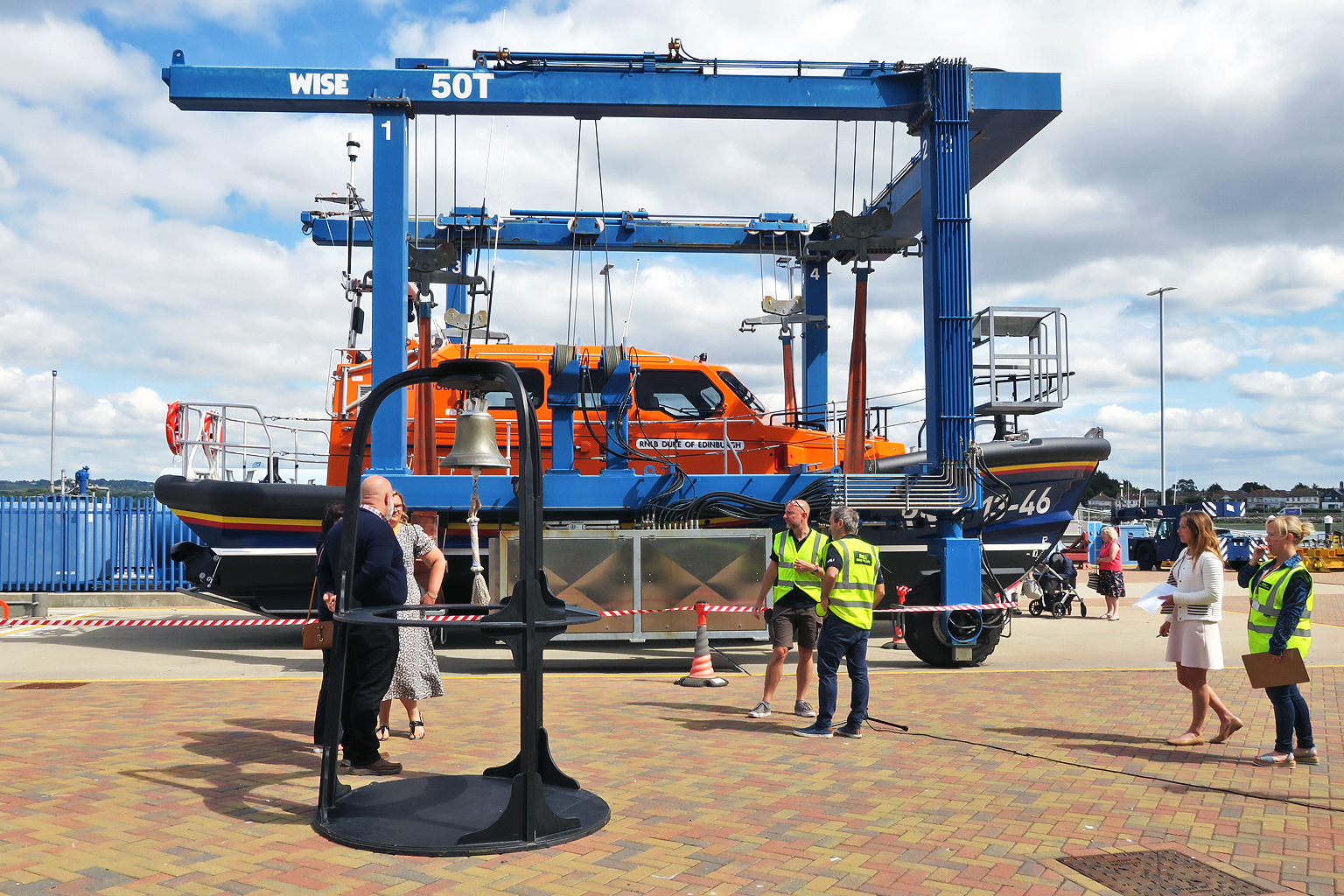 Setting up for the bell ringing ceremony as RNLB 'Duke Of Edinburgh' waits to be lifted into the water