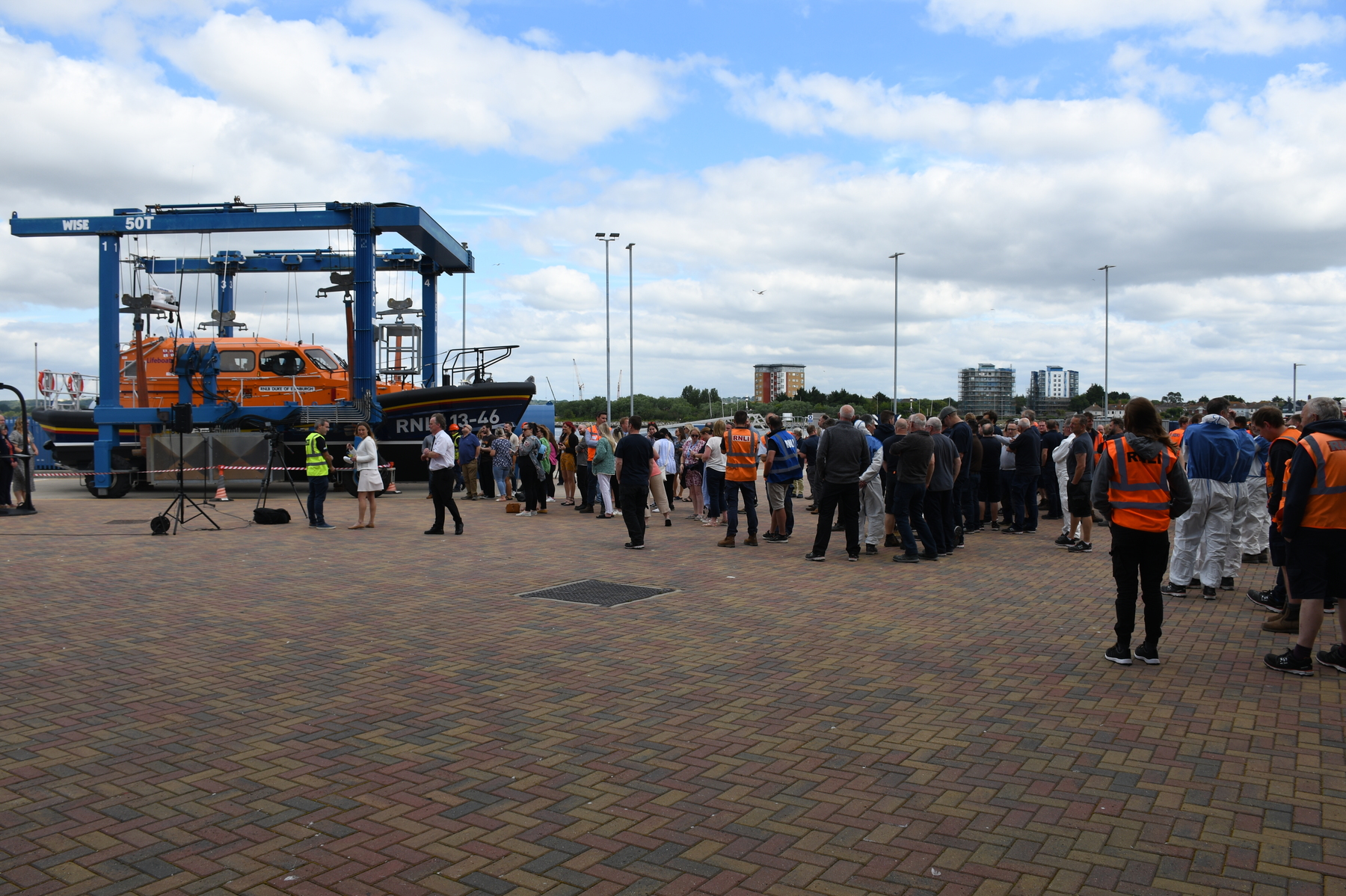 A small audience of invited guests, staff and workers from the All Weather Lifeboat centre gathers