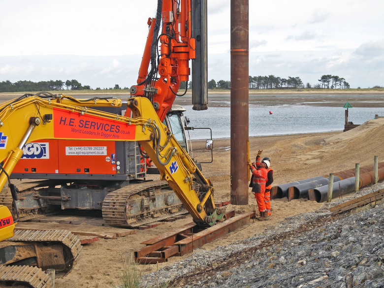 First pile for the ramp being driven into the beach