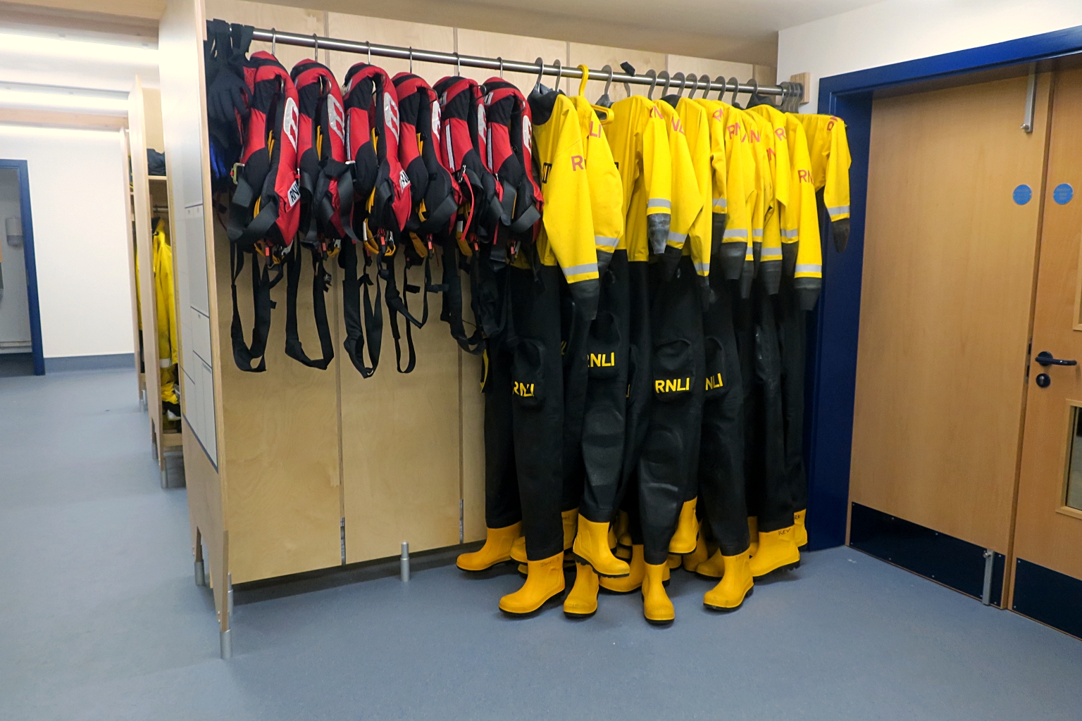 Inshore lifeboat crew drysuits and lifejackets in the changing room