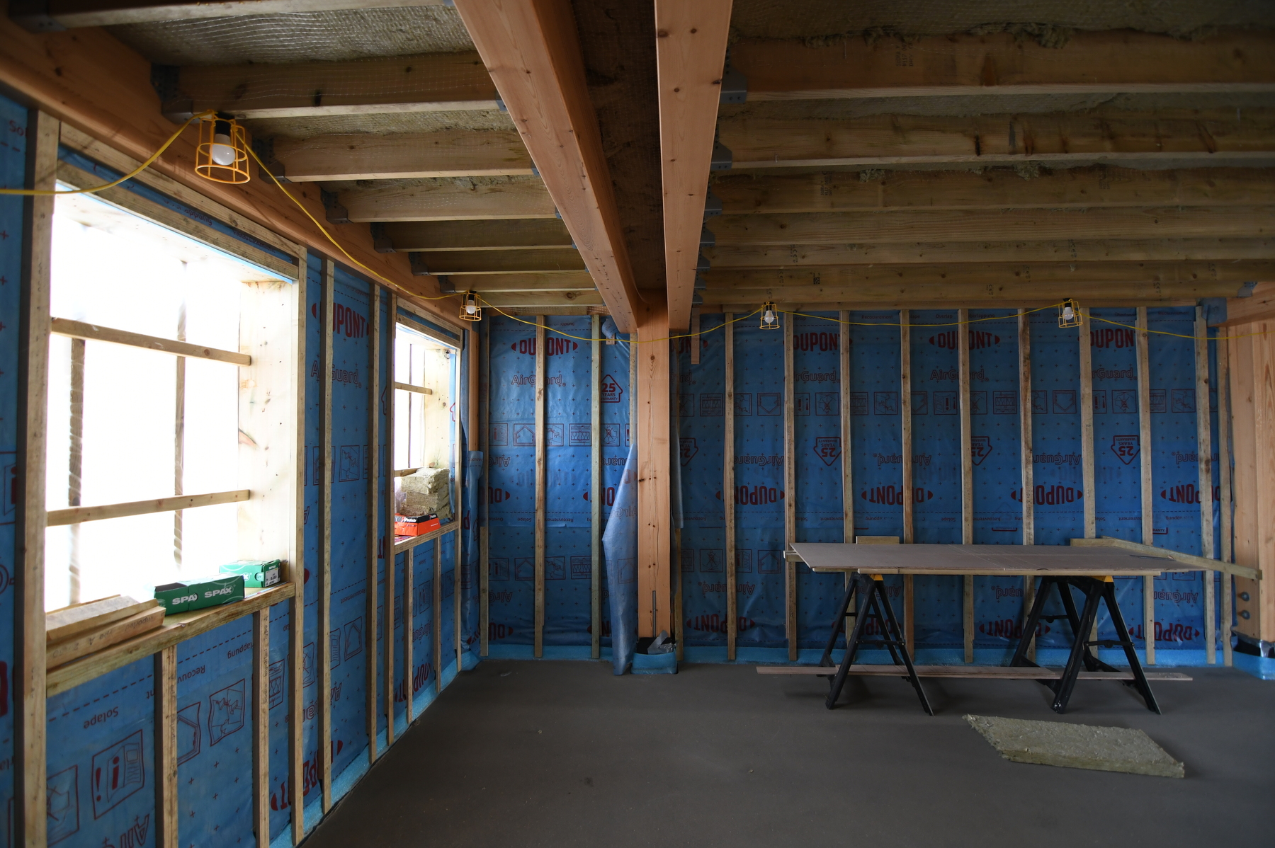 Insulating the walls with a layer to prevent heat loss and air leakage