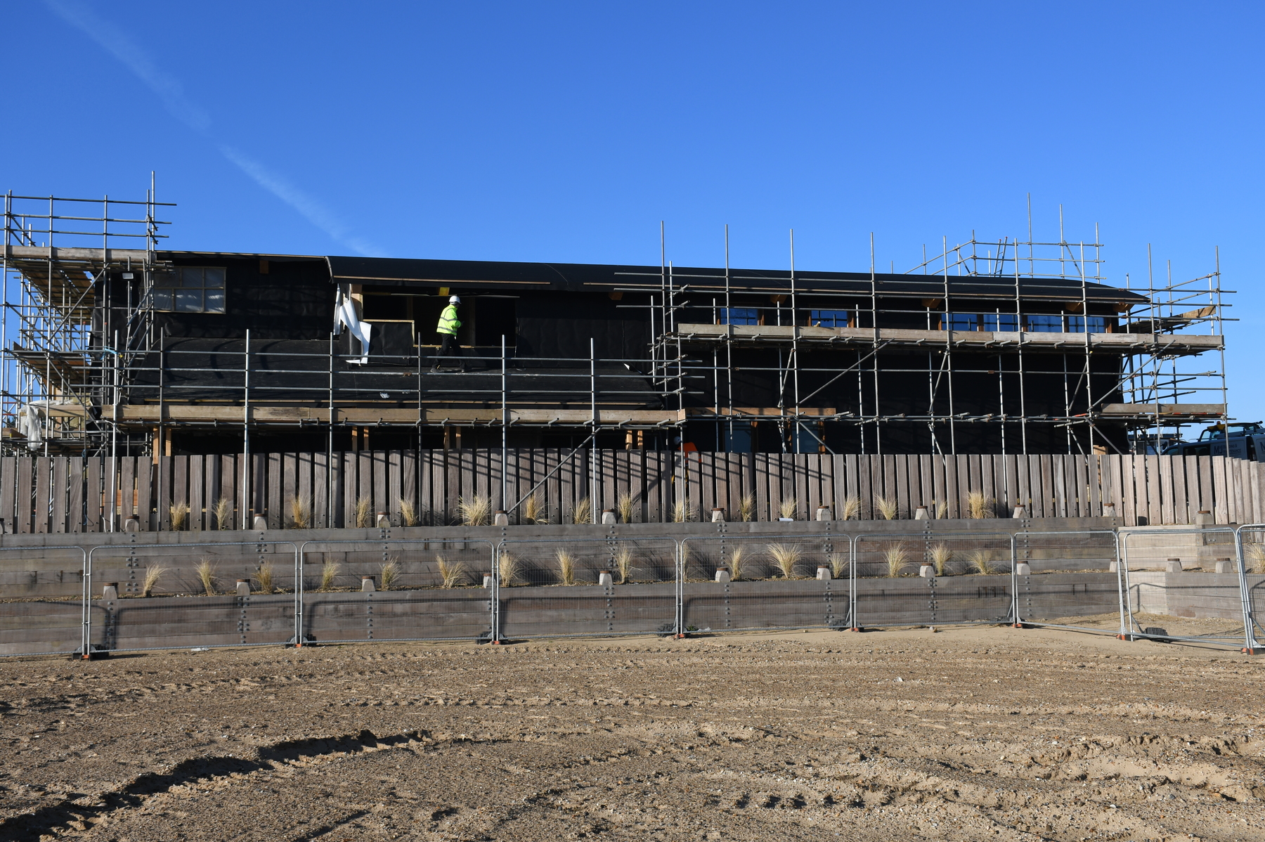 Thermal protective layer added to east side of building