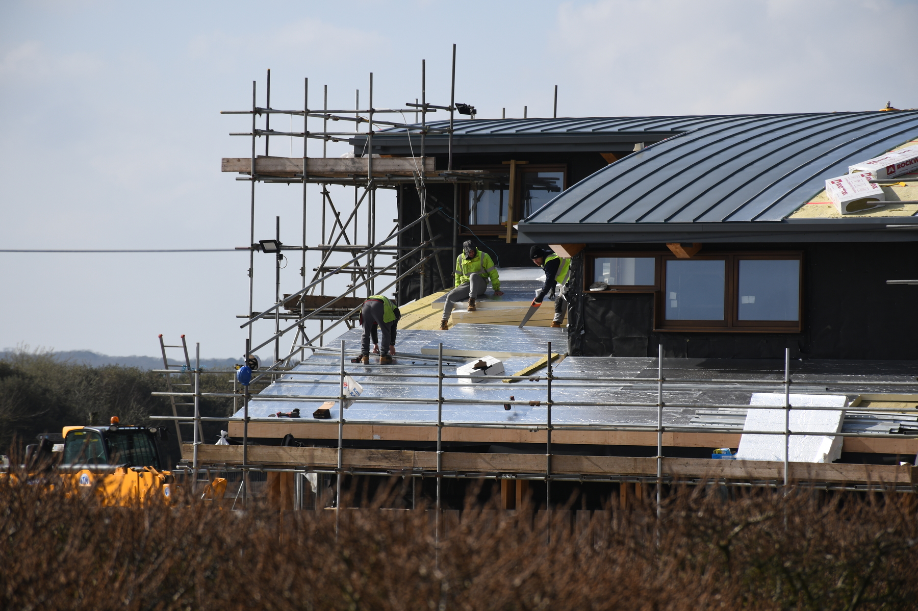 Completing the roof with insulation and battens prior to adding the exterior panelling