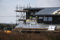 Completing the roof with insulation and battens prior to adding the exterior panelling