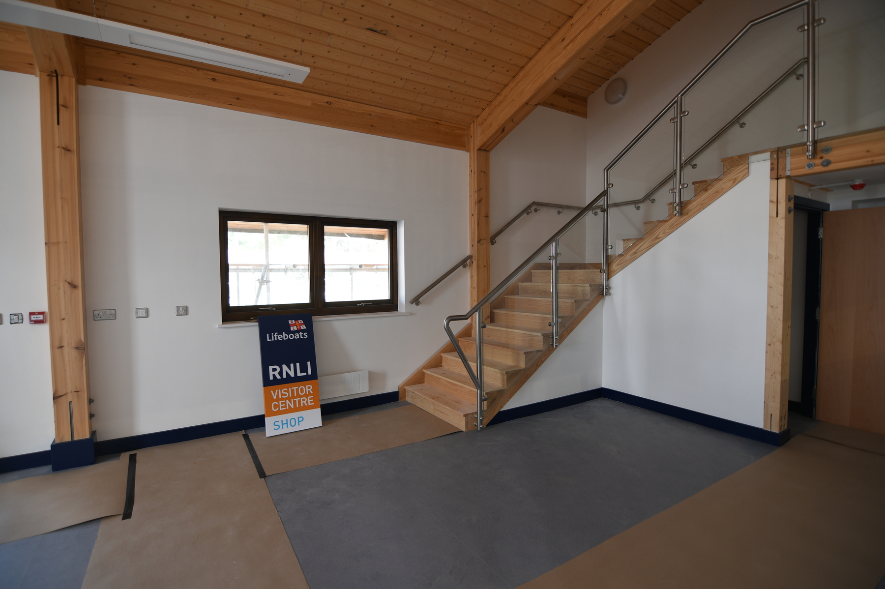 Shop and visitor area coming on, with stairs up to public viewing platform