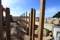 Rows of timber piles installed for the terracing around the perimeter of the site