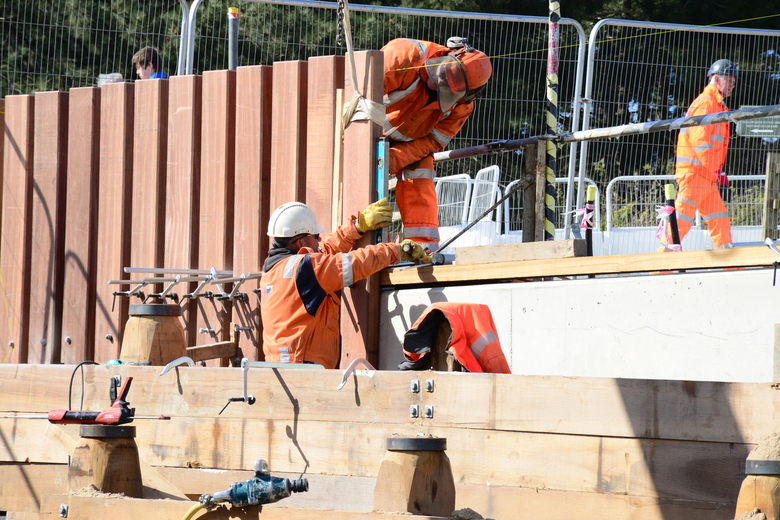 Installing Ekki planks onto the capping beam to form a guard rail