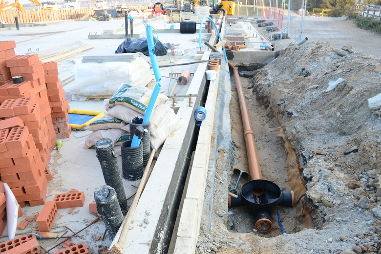 Drainage runs along the western edge of the building