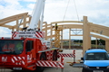 Boat hall roof beams being lifted into place