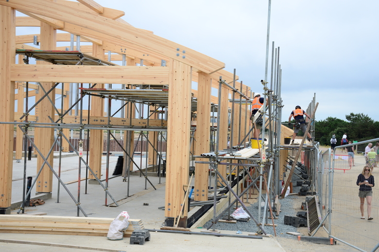 Scaffolding being erected on the west side of the building