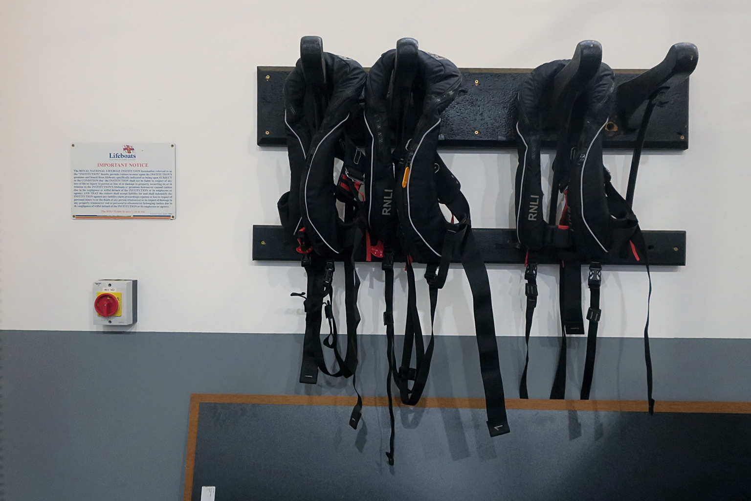 Original hooks for horse harnesses from the old boathouse now moved to the new building... and still being used for lifejackets!