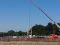 First part of the frame for the new boathouse being lifted into place