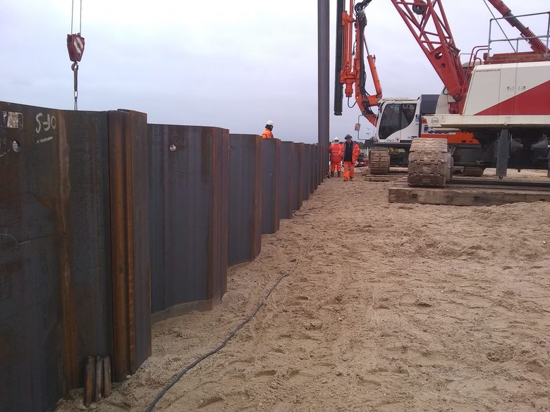 Sheet piling being added around the boathouse site