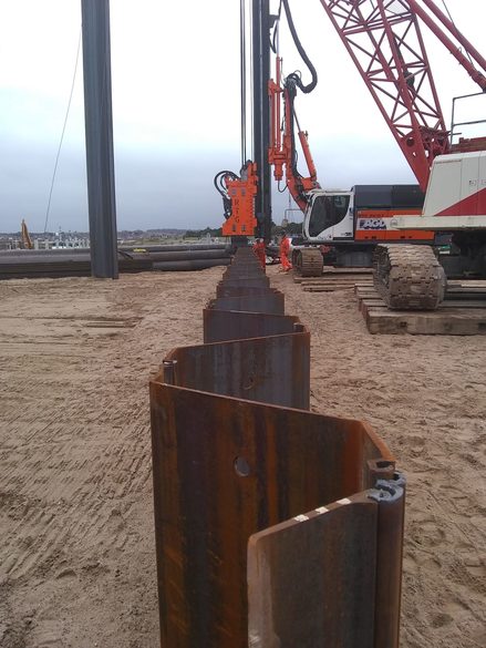 Sheet piling being added around the boathouse site