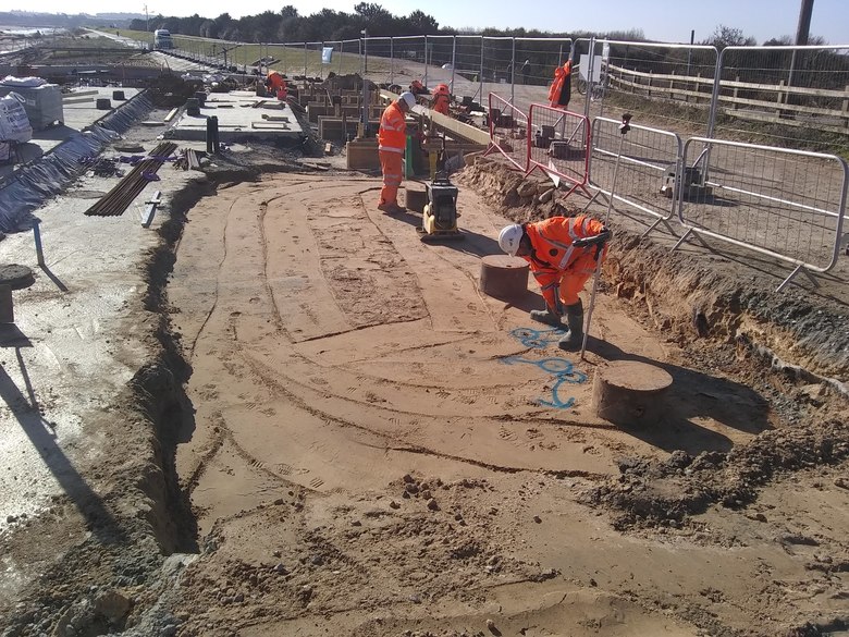 Tops of the tubular piles exposed on the western edge of the site as services are being installed