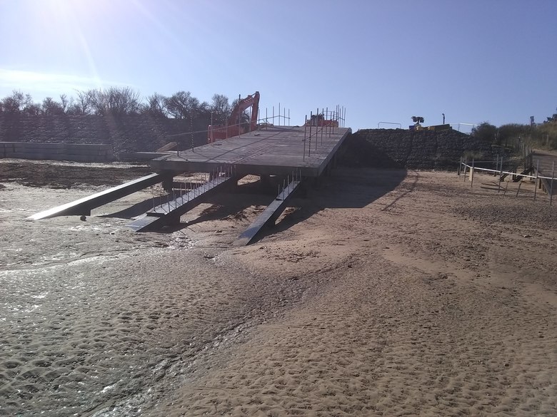 Concrete planks lifted onto and installed on ALB ramp