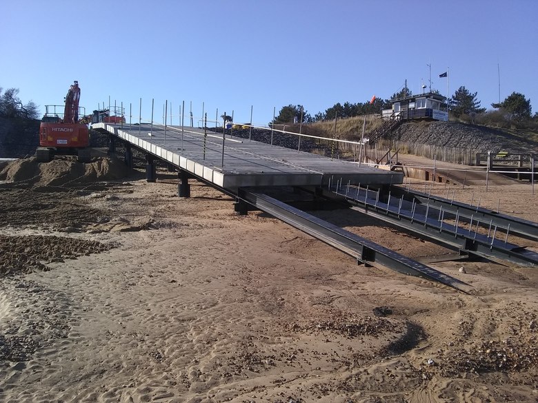 Concrete planks lifted onto and installed on ALB ramp