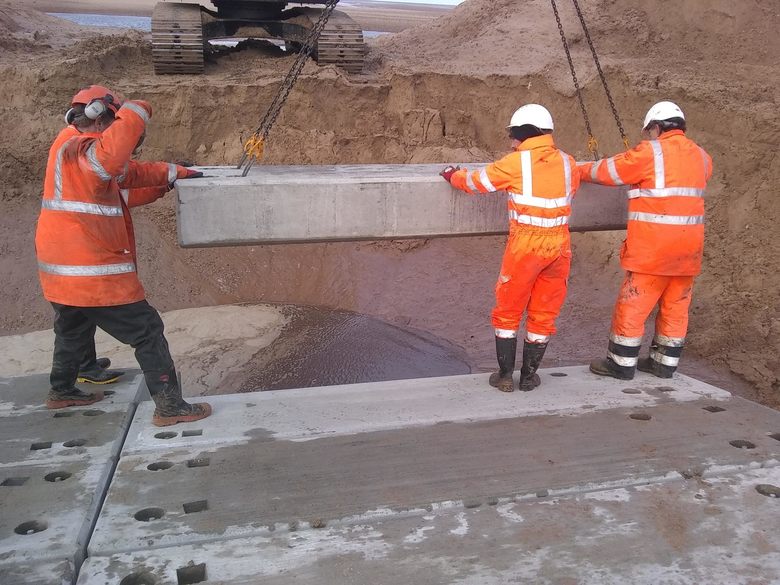 Final precast concrete planks being installed at the foot of the ALB ramp