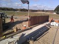 Ekki planks being installed to provide a guard rail around the site