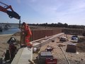 Guard rail planking continuing round the eastern edge of the site