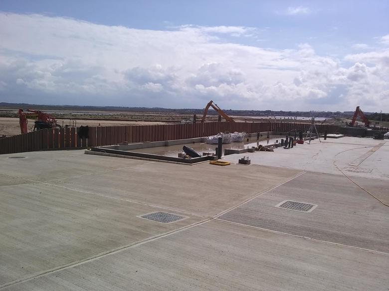 Completed front apron and completed guard rail planking around the site and down the ILB ramp