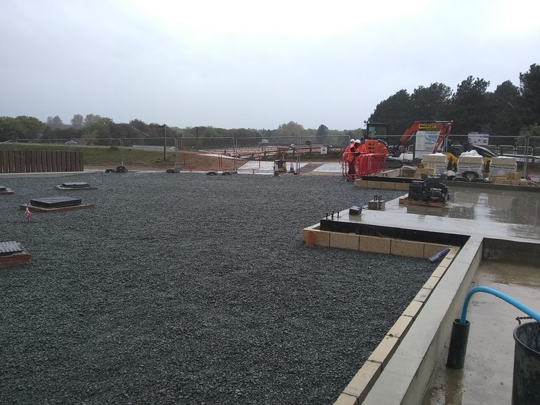 Tidying up the site after filling the area to the south of the boathouse