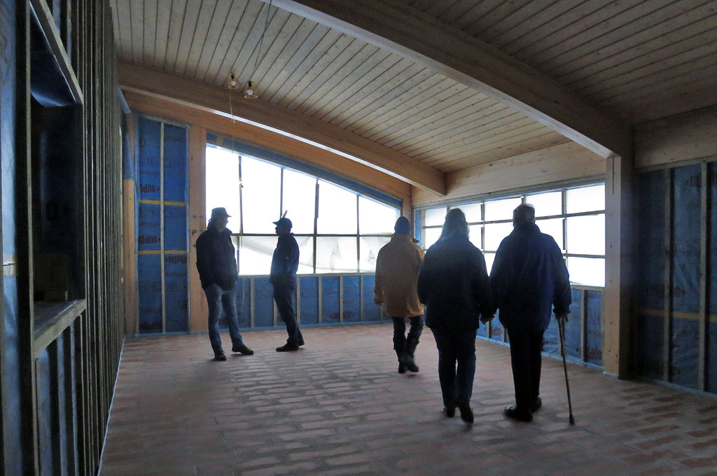 Retired Wells RNLI Honorary Secretary Richard Cracknell (r) and crew visiting the building just after Christmas