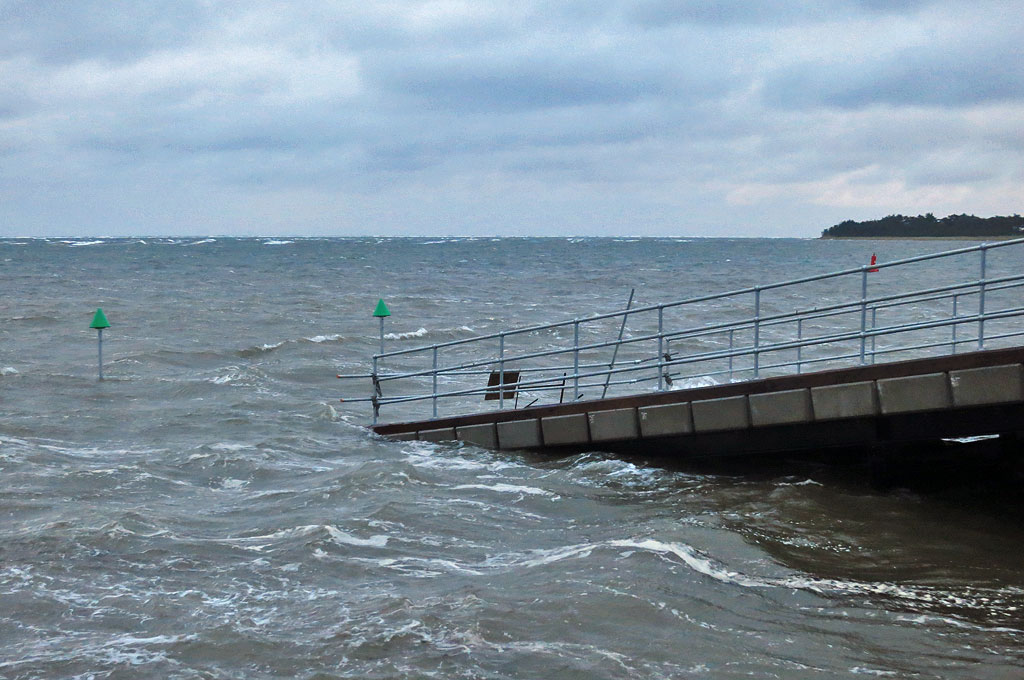 New navigation marks - and the sea well up the new launching ramp - on a particularly high tide