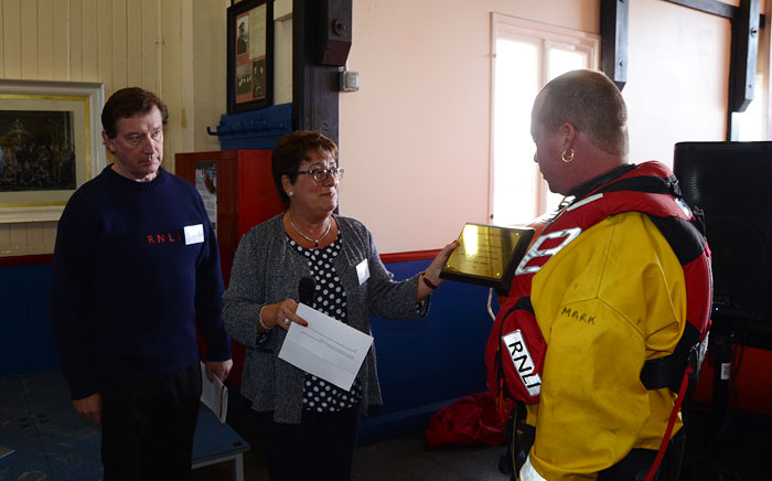 Jayne Wilcox presents Senior Helmsman Mark Frary with a dedication plaque