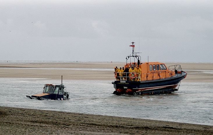 The Talus partly submerged towing carriage and lifeboat on the winch cable