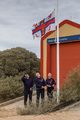 At 12:03, Billy Scoles, Fred Whitaker and Phil Eaglen lower the flag on the old boathouse for the last time