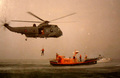 RAF Sea King in NATO green, working with the <i>Ernest Tom Nethercoat</i>  