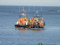 Old and new Wells lifeboats together as the tow is rearranged alongside prior to berthing in the outer harbour